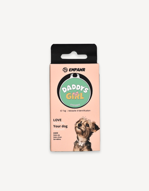 Empawr "Daddy's Girl" charm packaging, featuring a green charm with yellow text and a pink bow on a card with the brand logo and the phrase "Love Your Dog." A small dog is pictured on the right side of the card.